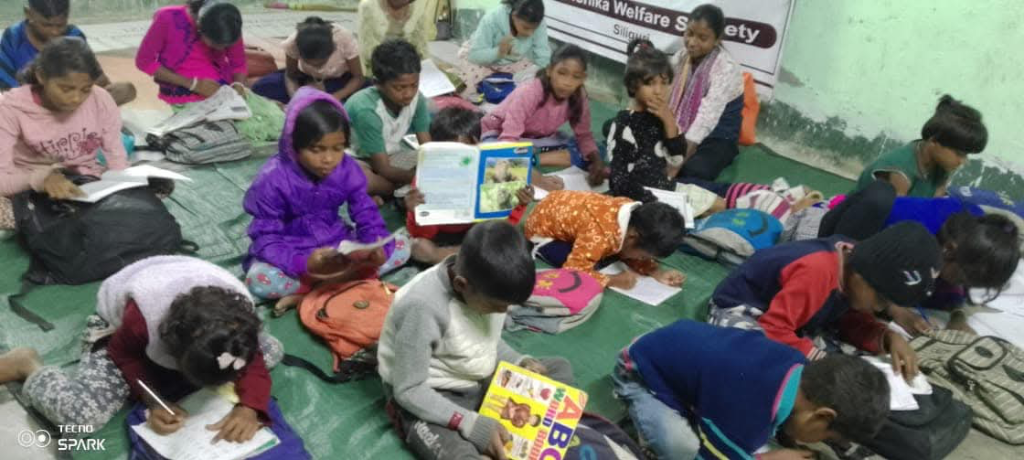 Children studying on the floor at the Learning Centre