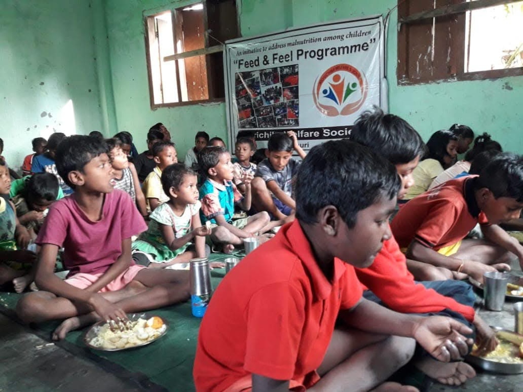 Children eating meals inside a classroom under the Feed & Feel Programme